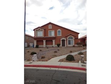 Two-story house with stucco siding and landscaped front yard at 5459 Cactus Thorn Ave, Las Vegas, NV 89118