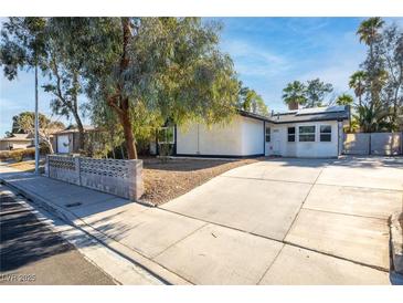 Single-story house with a landscaped yard and driveway at 6223 Foothill Blvd, Las Vegas, NV 89118