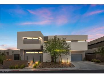 Modern two-story home with clean lines and a landscaped front yard at 21 Canyon Bay Dr, Henderson, NV 89011