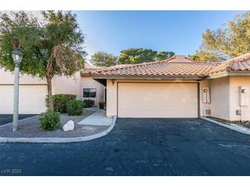 Charming home featuring a two-car garage, desert landscaping, and a welcoming entrance at 3663 Laguna Verde Way, Las Vegas, NV 89121