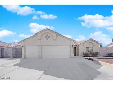 Charming single-story home with a three-car garage and a well-maintained front yard at 3923 Gramercy Ave, North Las Vegas, NV 89031