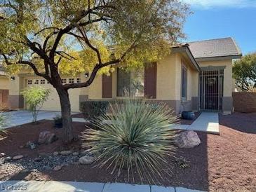 Charming single-story home featuring a low-maintenance desert-style front yard at 4217 Box Canyon Falls Ave, North Las Vegas, NV 89085