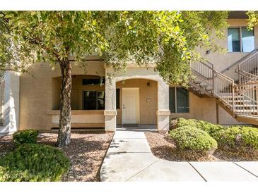 Inviting condo entry with covered patio and landscaped walkway at 8805 Jeffreys St # 1019, Las Vegas, NV 89123