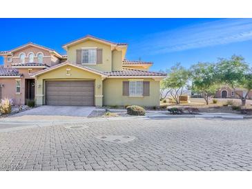 Charming two-story home featuring a neutral color scheme, well-manicured landscaping, and a two-car garage at 4 Via Centrale # 3, Henderson, NV 89011