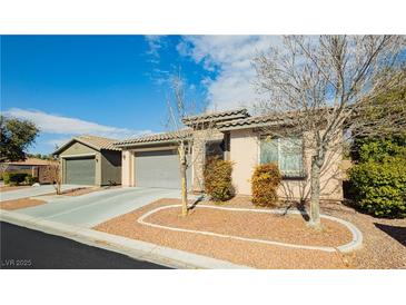 Charming single-story home with a two-car garage and low-maintenance landscaping at 5468 Carrara Pointe St, Pahrump, NV 89061