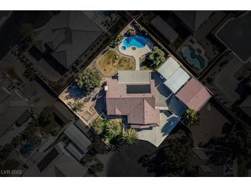 Aerial view of a house with pool and landscaped yard at 5625 W Agate Ave, Las Vegas, NV 89139