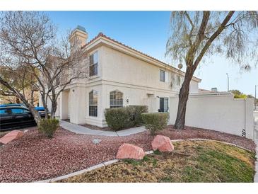 Two story house with landscaping and driveway at 7987 Cina Ave, Las Vegas, NV 89147