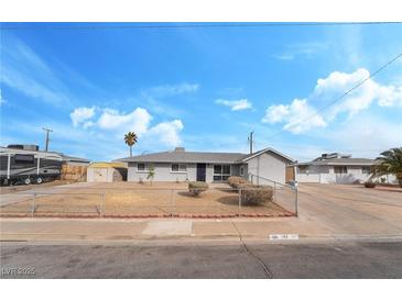 Charming single-story home with a well-maintained front yard and chain-link fence at 142 Ivy St, Henderson, NV 89015