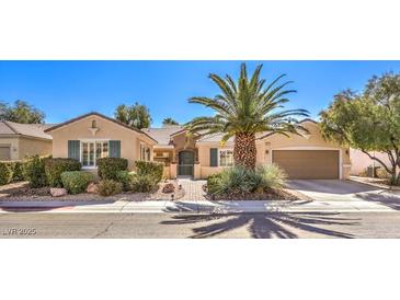 Charming single-story home with a well-manicured front yard and mature landscaping at 2277 Canyonville Dr, Henderson, NV 89044