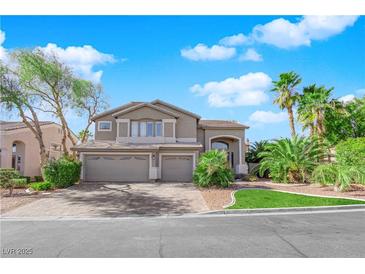 Two-story house with a three-car garage and landscaped yard at 2891 Painted Lilly Dr, Las Vegas, NV 89135
