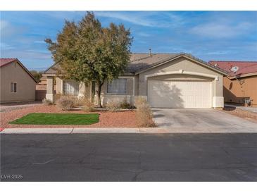 Single-story house with a two-car garage and landscaped front yard at 3713 Nairobi Ln, North Las Vegas, NV 89032