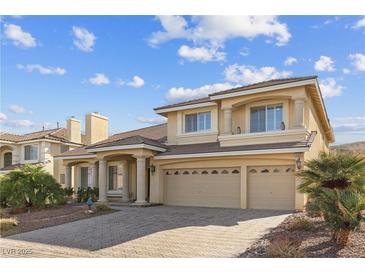 Charming two-story home boasts a three-car garage and well-maintained landscaping at 4439 Melrose Abbey Pl, Las Vegas, NV 89141