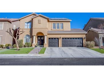 Stunning two-story home with manicured lawn and a two car garage at 10654 Sidlaw Hills Ct, Las Vegas, NV 89141