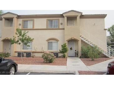 Tan two-story building with stairs and landscaping at 3400 Cabana Dr # 2009, Las Vegas, NV 89122