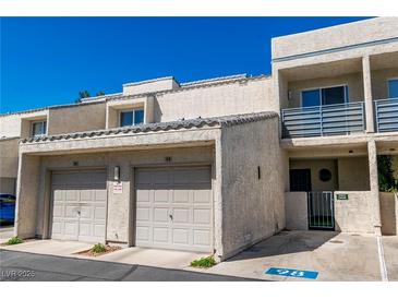 Charming two-story townhome with a two-car garage and private gated entrance at 6250 W Flamingo Rd # 98, Las Vegas, NV 89103