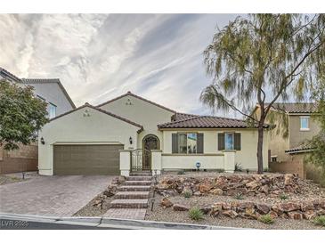 Charming single-story home featuring a well-manicured front yard and inviting facade at 1189 Hillside Peak St, Henderson, NV 89002