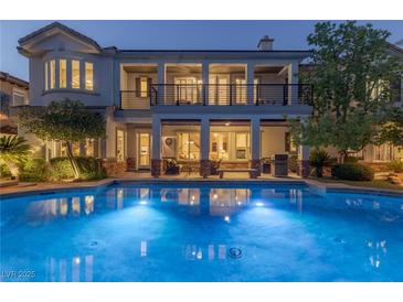 Luxury home with inviting pool and expansive covered patio at 1975 Alcova Ridge Dr, Las Vegas, NV 89135