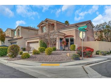 Two-story house with landscaped yard and attached garage at 11740 Via Esperanza Ave, Las Vegas, NV 89138
