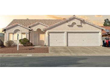 Charming single-story home with desert landscaping and a two-car garage at 840 Candido Garcia Ave, Henderson, NV 89015