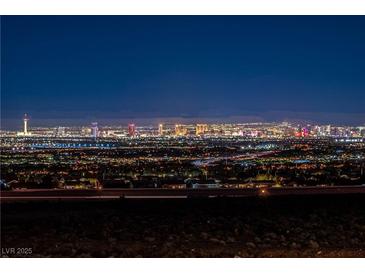 Expansive night view of the Las Vegas cityscape, showcasing vibrant lights and the iconic skyline at 2384 Ridgeline Wash St, Las Vegas, NV 89138