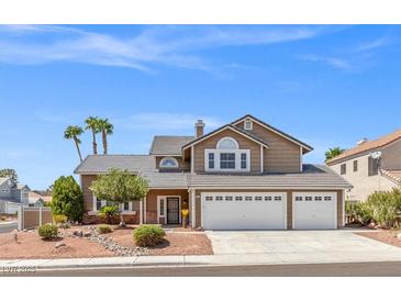 Charming two-story home featuring a three-car garage, well-maintained landscaping, and a welcoming facade at 3305 Cutty Sark St, Las Vegas, NV 89117