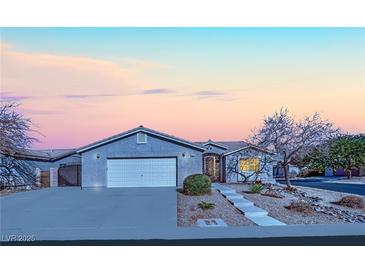 Charming single-story home with a well-maintained front yard and a two-car garage at 7912 Rushmore Ave, Las Vegas, NV 89131