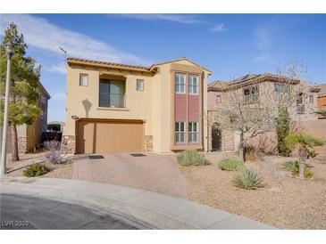 Inviting two-story home featuring desert landscaping and a two-car garage at 500 Via Stretto Ave, Henderson, NV 89011