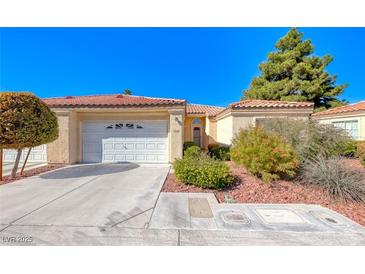 Single-story house with a garage and well-manicured landscaping at 7232 Vista Bonita Dr, Las Vegas, NV 89149