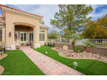 Charming single-story home with a beautifully landscaped front yard and inviting entryway at 9300 Villa Ridge Dr, Las Vegas, NV 89134