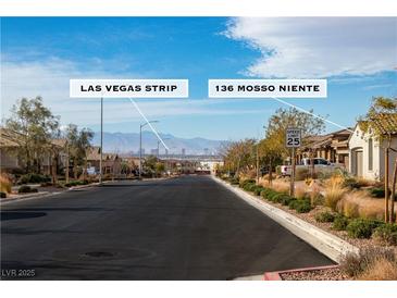 Neighborhood street view showcasing the Las Vegas Strip in the distance at 136 Mosso Niente Pl, Henderson, NV 89011