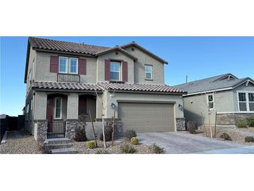 Two-story house with taupe exterior, red shutters, and a three-car garage at 3498 Monte Cervino Ave, Henderson, NV 89044