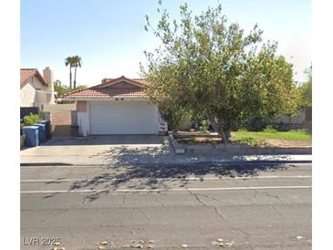 Charming single-Gathering home with a well-maintained front yard and a two-car garage at 3826 S Torrey Pines Dr, Las Vegas, NV 89103