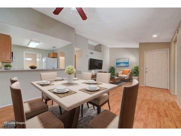 Bright dining area with table and chairs, open to living room at 1800 Edmond St # 252, Las Vegas, NV 89146