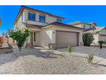 Charming two-story home featuring a two-car garage and low-maintenance desert landscaping at 6027 Stone Hollow Ave, Las Vegas, NV 89156