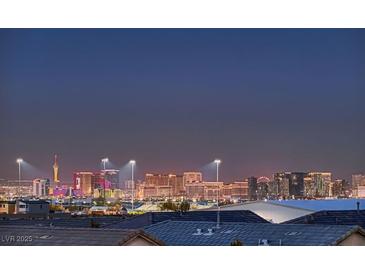 Panoramic city view showcasing the Las Vegas skyline at dusk from a residential neighborhood at 8560 Foundry Branch Ln, Las Vegas, NV 89113