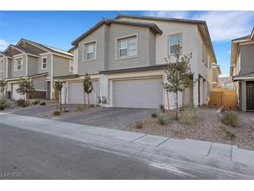 Beautiful new construction home featuring a spacious two-car garage and modern architectural details at 787 Cottonwood Hill Pl, Henderson, NV 89011