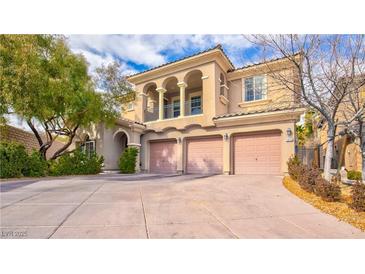 Stunning two-story home with a three-car garage and beautiful landscaping at 12118 La Carta Ct, Las Vegas, NV 89138