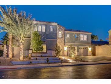 Stunning two-story home showcasing meticulous landscaping and a welcoming two-car garage at 2796 Rosenhearty Dr, Henderson, NV 89044