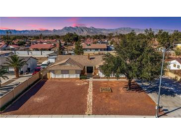 Charming single-story home with a well-manicured front yard and mountain views at 3716 N Torrey Pines Dr, Las Vegas, NV 89108