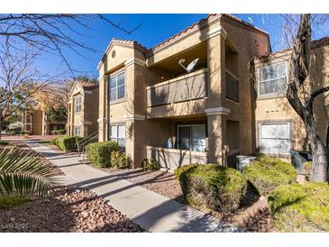 Charming condo complex with well-maintained landscaping, private balconies, and convenient access to walkways at 2300 E Silverado Ranch Blvd # 2162, Las Vegas, NV 89183