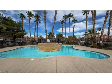 Community pool featuring a shallow pool and palm trees at 4730 E Craig Rd # 1172, Las Vegas, NV 89115