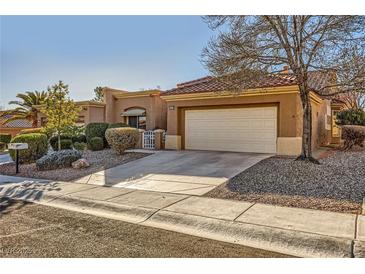 Charming single-story home with a two-car garage, desert landscaping, and a cozy, inviting curb appeal at 10013 Arbuckle Dr, Las Vegas, NV 89134