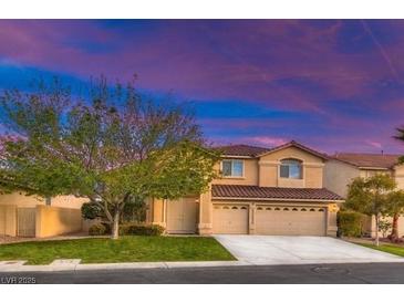 Charming two-story home with manicured lawn and three car garage at 283 Auster Park Ave, Las Vegas, NV 89148