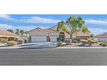 Charming single-story home features a three car garage and desert landscaping at 6710 Pyracantha Glen Ct, Las Vegas, NV 89131