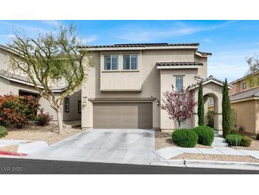 Charming two-story home with a well-manicured lawn and an attached two-car garage at 9138 Sea Mink Ave, Las Vegas, NV 89149