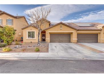 Charming single-Gathering home featuring a two-car garage and desert landscaping at 3934 Jamison Park Ln, North Las Vegas, NV 89032