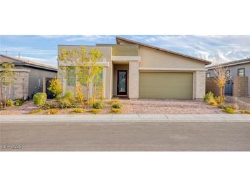 Charming home featuring modern architectural elements and a manicured front yard at 924 Mayfield Manor Ln, Las Vegas, NV 89138