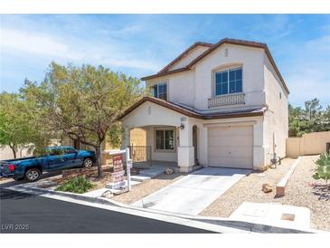 Charming two-story home featuring stucco siding, a covered porch, and a well-maintained front yard at 9527 Havasu Canyon Ave, Las Vegas, NV 89166