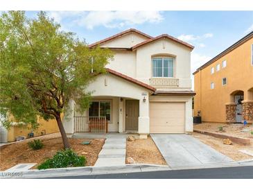 Charming two-story home with a desert landscape, covered porch, and attached one car garage at 9527 Havasu Canyon Ave, Las Vegas, NV 89166