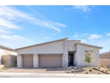 Charming single-story home with a stone accent wall and a two-car garage at 116 Juliette Pointe Ln, Henderson, NV 89011